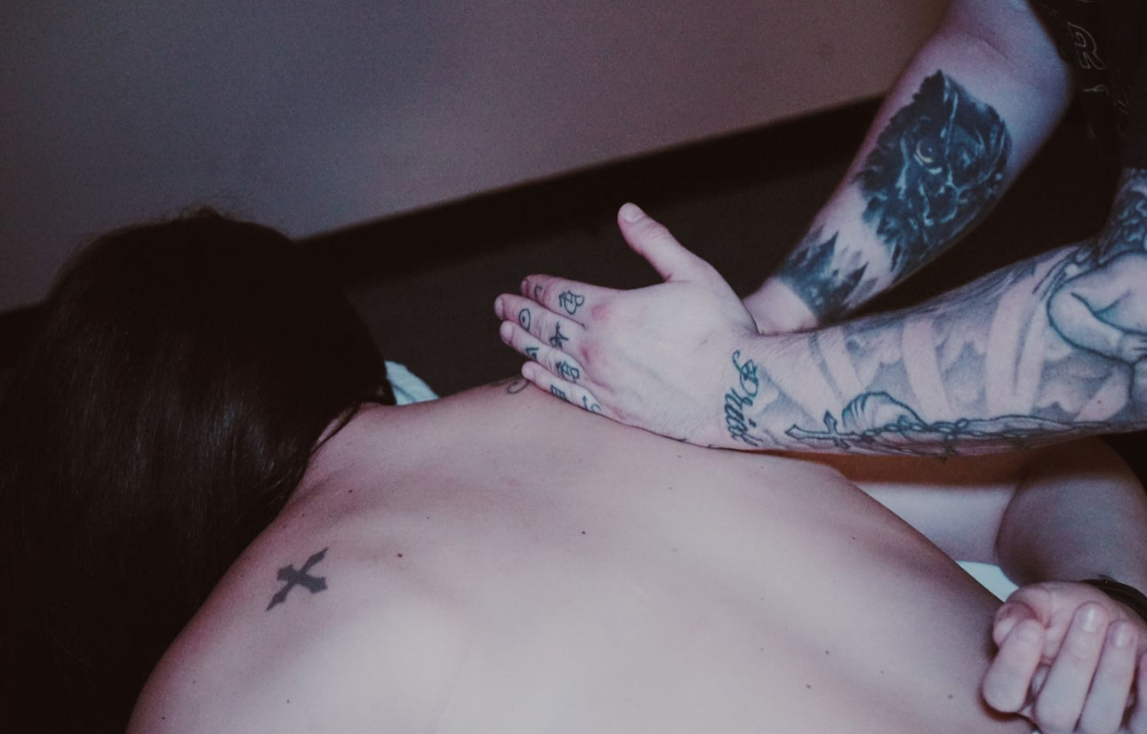 Man giving therapeutic massage on the back