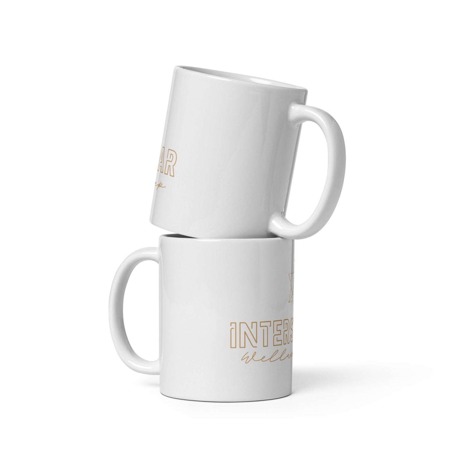 Two white mugs with gold text on a white background